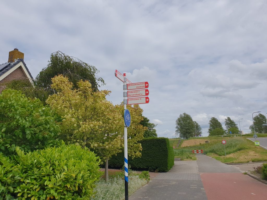 A signpost in Medemblik points to Enkhuizen